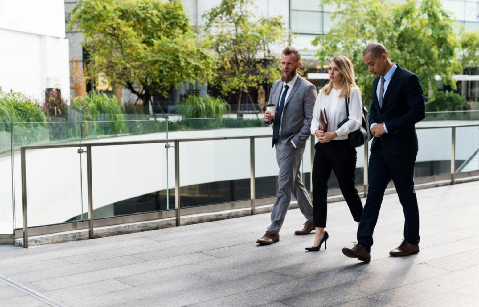 Professional financial consultation session showing educational materials and planning documents